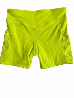 Fabletics activewear shorts in a vibrant neon lime (004)